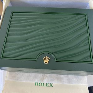 Rolex box and paper